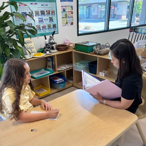 An instructor working one-to-one with a student