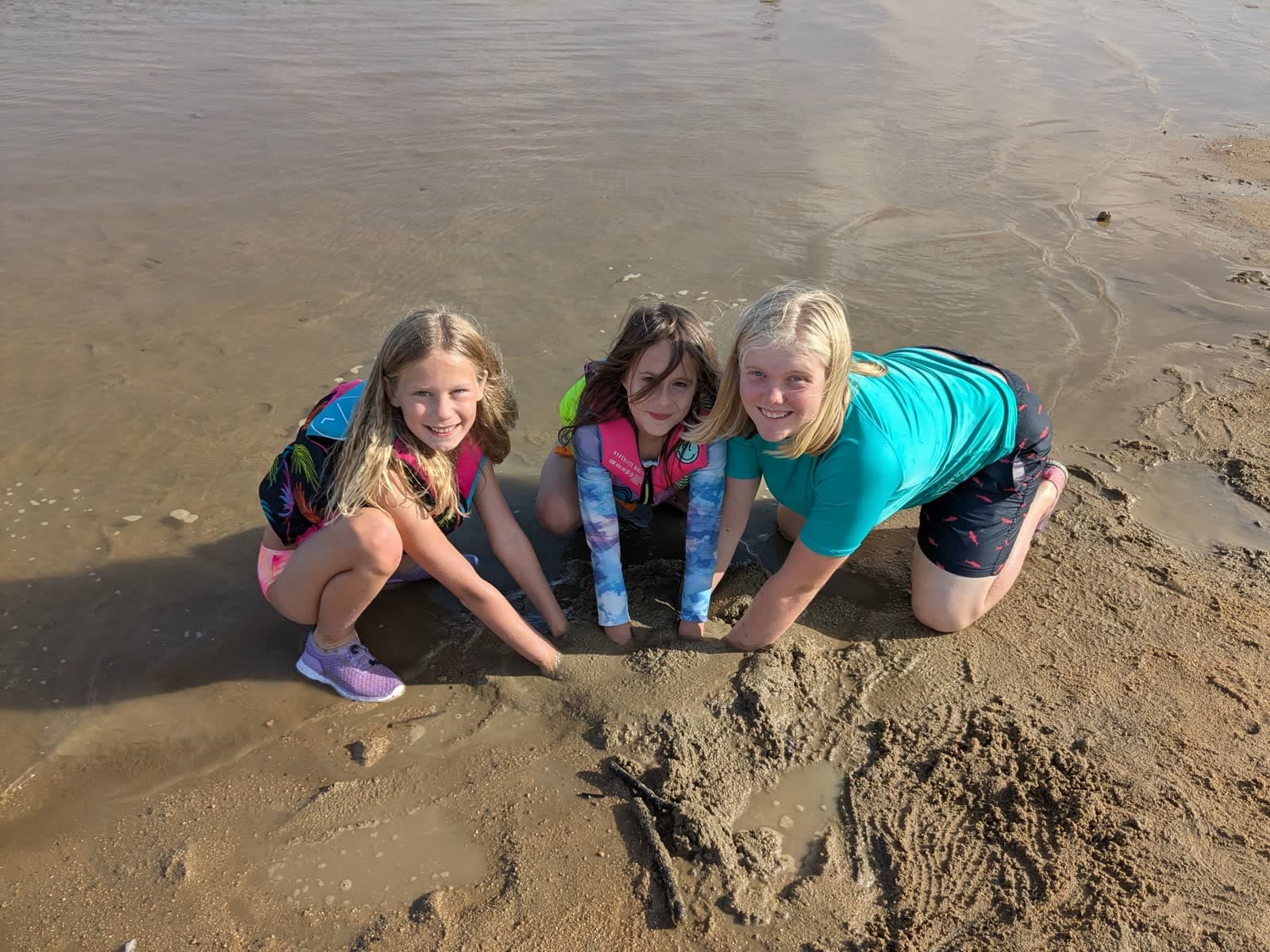 Students at the shoreline on a field trip
