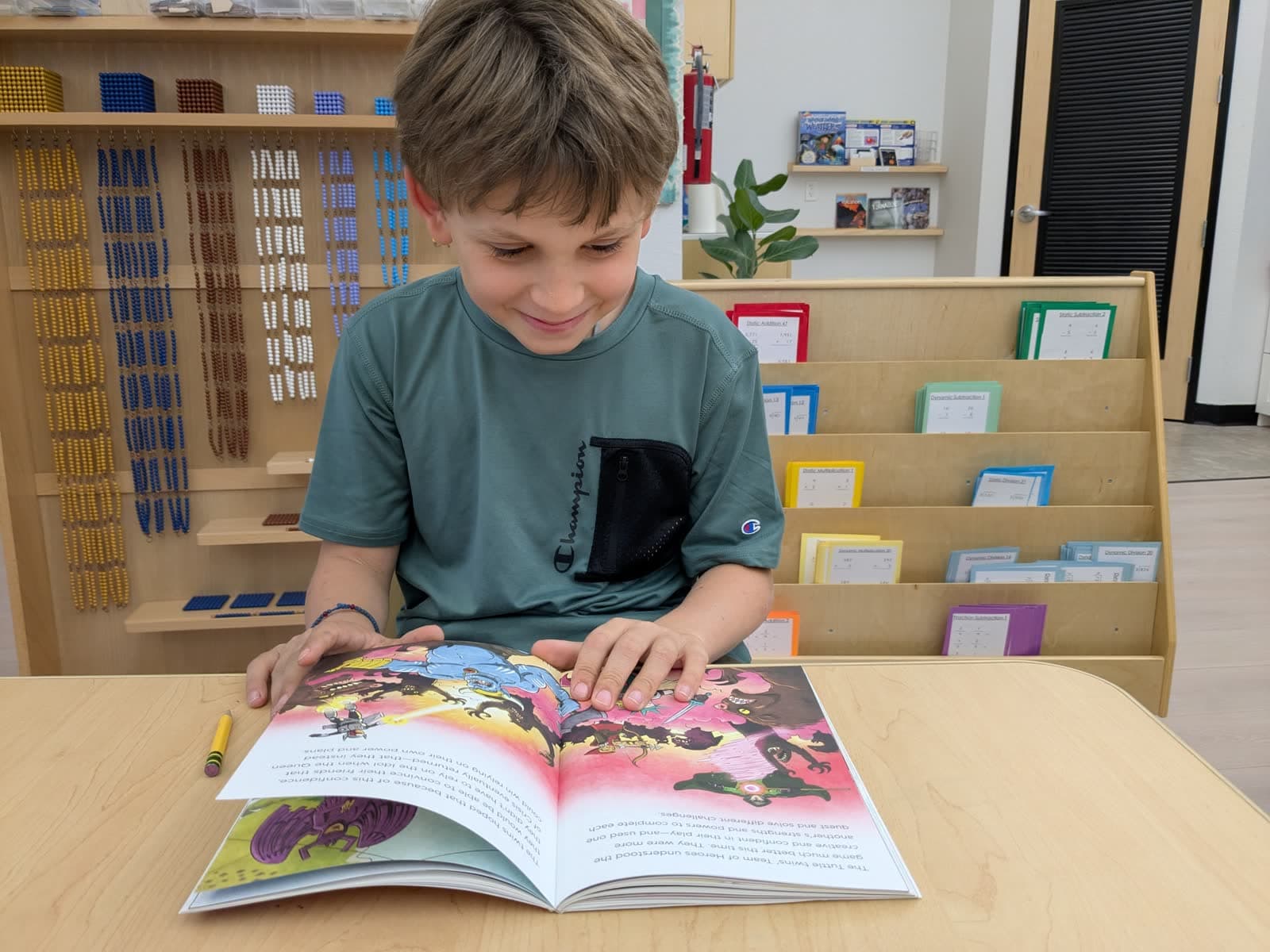 A student reading a book in the classroom